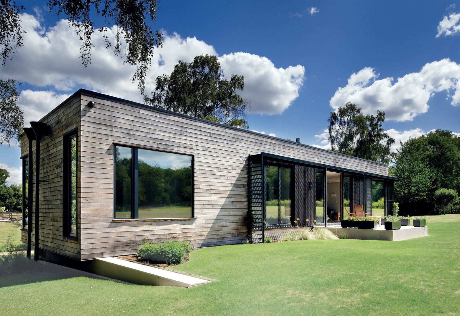 Illustrative reference of a residence beneath large mature trees