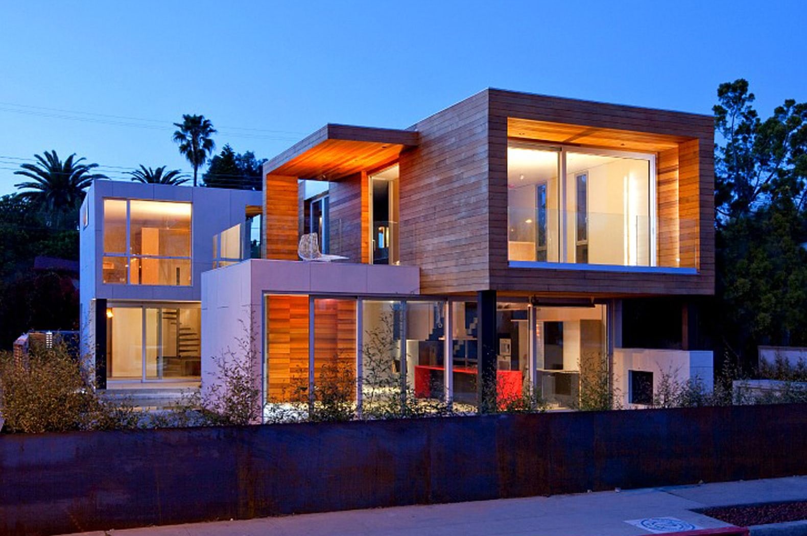 Illustrative reference of a timber residence among palms at dusk